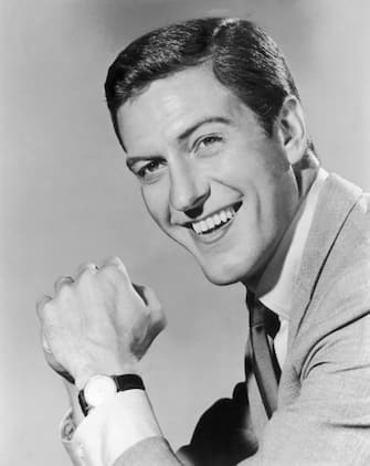 Headshot portrait of American actor and comedian Dick Van Dyke smiling with his hands clasped in front of him.  (Photo by Archive Photos/Getty Images)
