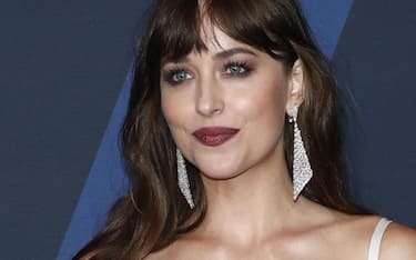 epa07955440 US actress Dakota Johnson poses on the red carpet prior the 11th Annual Governors Awards at the Dolby Theater in Hollywood, California, USA, 27 October 2019.  EPA/NINA PROMMER