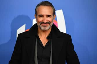 French actor Jean Dujardin poses on the red carpet for a photocall upon his arrival prior to the draw for the 2023 Rugby Union World Cup, in Paris, on December 14, 2020. (Photo by FRANCK FIFE / AFP) (Photo by FRANCK FIFE/AFP via Getty Images)