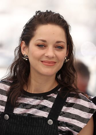 CANNES, FRANCE - JULY 10: Marion Cotillard attends the "Bigger Than Us" photocall during the 74th annual Cannes Film Festival on July 10, 2021 in Cannes, France. (Photo by Mike Marsland/WireImage)
