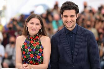 French actress Laetitia Casta (L) and French actor and director Louis Garrel pose during a photocall for the film "La Croisade" at the 74th edition of the Cannes Film Festival in Cannes, southern France, on July 12, 2021. (Photo by Valery HACHE / AFP) (Photo by VALERY HACHE/AFP via Getty Images)