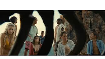 (from left) Chrystal (Abbey Lee), Patricia (Nikki Amuka-Bird), Jarin (Ken Leung), Maddox (Thomasin McKenzie), Charles (Rufus Sewell), Mid-Sized Sedan (Aaron Pierre), Prisca (Vicky Krieps) and Guy (Gael García Bernal) in Old, written for the screen and directed by M. Night Shyamalan.