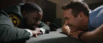 (L-R): Lil Rel Howery as Buddy and Ryan Reynolds as Guy in 20th Century Studios’ FREE GUY. Courtesy of 20th Century Studios. © 2021 20th Century Studios. All Rights Reserved. 