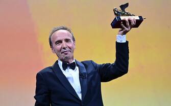 Italian actor and director, Roberto Benigni acknowledges receiving a Golden Lion for lifetime achievement, during the the opening ceremony of the 78th Venice Film Festival, on September 1, 2021 at Venice Lido. (Photo by MIGUEL MEDINA / AFP) (Photo by MIGUEL MEDINA/AFP via Getty Images)