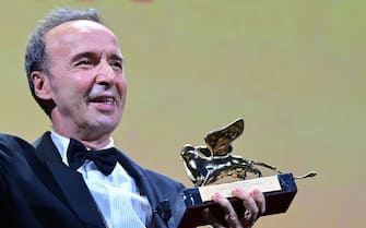 Italian actor and director, Roberto Benigni acknowledges receiving a Golden Lion for lifetime achievement, during the the opening ceremony of the 78th Venice Film Festival, on September 1, 2021 at Venice Lido. (Photo by MIGUEL MEDINA / AFP) (Photo by MIGUEL MEDINA/AFP via Getty Images)
