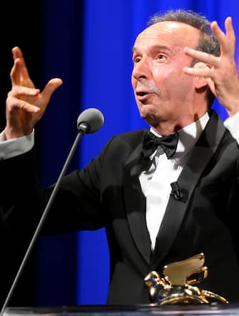 Italian filmmaker and actor Roberto Benigni poses after he received the the Golden Lion for Lifetime Achievement Award during the Opening Ceremony at the 78th annual Venice International Film Festival, in Venice, Italy, 01 September 2021. 
 The festival runs from 01 to 11 September 2021.