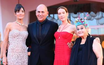 (L-R) Italian actress Ambra Angiolini, Turkish director Ferzan Ozpetek, Italian actress Cristiana Capotondi and a guest arrive for the premiere of 'Freaks Out' during the 78th annual Venice International Film Festival, Venice, Italy, 08 September 2021. The movie is presented in the Official competition 'Venezia 78' at the festival running from 01 to 11 September.  ANSA/CLAUDIO ONORATI






 