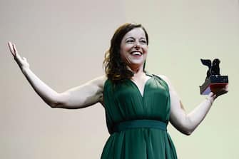 French actress Laure Calamy acknowledges receiving the Orizzonti Award for Best Actress for "Full Time" during the closing ceremony of the 78th Venice Film Festival on September 11, 2021 at Venice Lido. (Photo by Filippo MONTEFORTE / AFP) (Photo by FILIPPO MONTEFORTE/AFP via Getty Images)
