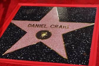 1235738289 British actor Daniel Craig is honored with a star on the Hollywood Walk of Fame in Los Angeles, California, on October 6, 2021. - Craig's star will be located at 7007 Hollywood Boulevard, chosen for Craig's portrayal of James Bond in '007' films. (Photo by VALERIE MACON / AFP) (Photo by VALERIE MACON/AFP via Getty Images)