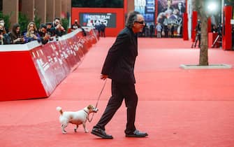 American director, Tim Burton and his dog Levi, on the red carpet at the 16th annual Rome International Film Festival, in Rome, Italy, 23 October 2021. The Festa del Cinema di Roma runs from 14 to 24 October. ANSA/FABIO FRUSTACI