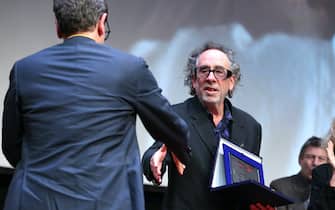 ROME, ITALY - OCTOBER 23: Antonio Monda congratulates Tim Burton on receiving a Lifetime Achievement Award at a close encounter during the 16th Rome Film Fest 2021 on October 23, 2021 in Rome, Italy. (Photo by Elisabetta Villa/Getty Images for RFF)