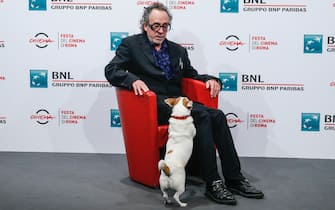 American director Tim Burton and his dog Levi, poses during a photocall at the 16th annual Rome International Film Festival, in Rome, Italy, 23 October 2021. The Festa del Cinema di Roma runs from 14 to 24 October. ANSA/FABIO FRUSTACI