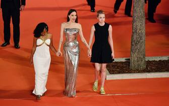 ROME, ITALY - OCTOBER 24: (L-R) Zahara Marley Jolie-Pitt, Angelina Jolie and Shiloh Jolie-Pitt attend the red carpet of the movie "Eternals" during the 16th Rome Film Fest 2021 on October 24, 2021 in Rome, Italy. (Photo by Antonio Masiello/Getty Images for RFF)
