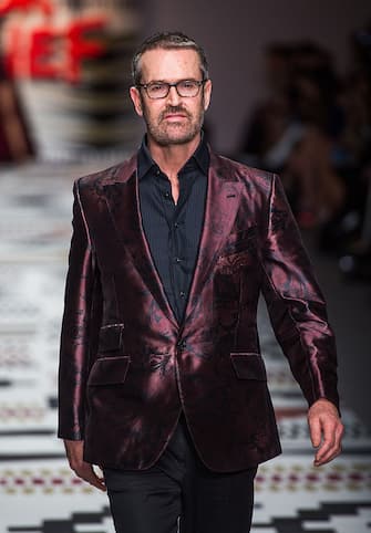 LONDON, ENGLAND - FEBRUARY 19:  Rupert Everett walks the runway at the Fashion For Relief charity fashion show to kick off London Fashion Week Fall/Winter 2015/16 at Somerset House on February 19, 2015 in London, England.  The Fashion For Relief show is in support of Ebola, raising funds and awareness for Disaster Emergency Committee: Ebola Crisis Appeal and the Ebola Survival Fund.  (Photo by Samir Hussein/WireImage)