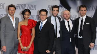 BERLIN - APRIL 16:  (L-R) Actors John Cho, Eric Bana, Karl Urban, Zoe Saldana, Director J.J. Abrams, Zachary Quinto, Simon Pegg and Chris Pine attend the 'Star Trek' Germany premiere on April 16, 2009 in Berlin, Germany.  (Photo by Andreas Rentz/Getty Images)
