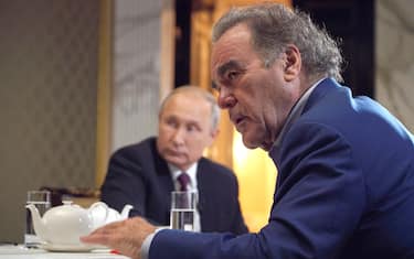 MOSCOW, RUSSIA - JUNE 19, 2019: US film director Oliver Stone (front) during an interview with the President of Russia Vladimir Putin in the Moscow Kremlin. Alexei Druzhinin. Alexei Druzhinin/Russian Presidential Press and Information Office/TASS (Photo by Alexei Druzhinin\TASS via Getty Images)