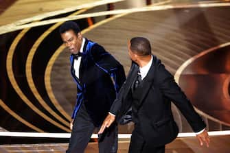 HOLLYWOOD, CA - March 27, 2022.    Will Smith slaps Chris Rock onstage during the show  at the 94th Academy Awards at the Dolby Theatre at Ovation Hollywood on Sunday, March 27, 2022.  (Myung Chun / Los Angeles Times via Getty Images)