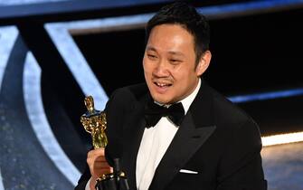 Japanese director Ryusuke Hamaguchi accepts the award for Best International Feature Film for "Drive My Car" onstage during the 94th Oscars at the Dolby Theatre in Hollywood, California on March 27, 2022. (Photo by Robyn Beck / AFP) (Photo by ROBYN BECK/AFP via Getty Images)