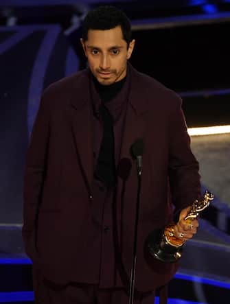 British actor Riz Ahmed accepts the award for Best Live Action Short Film for "The Long Goodbye" onstage during the 94th Oscars at the Dolby Theatre in Hollywood, California on March 27, 2022. (Photo by Robyn Beck / AFP) (Photo by ROBYN BECK/AFP via Getty Images)