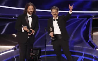 epa09854101 Spanish Director Alberto Mielgo (R) and Producer Leo Sanchez (L) accept the Oscar Best Animated Short Film for 'The Windshield Wiper' during the Oscars pre-telecast event at the 94th annual Academy Awards ceremony at the Dolby Theatre in Hollywood, Los Angeles, California, USA, 27 March 2022. Eight Oscars for the first time will be awarded prior to the telecast, the Oscars are presented for outstanding individual or collective efforts in filmmaking in 24 categories.  EPA/ETIENNE LAURENT