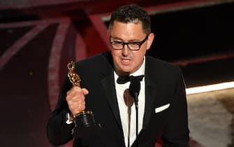 Australian cinematographer Greig Fraser accepts the award for Best Cinematography for "Dune" onstage during the 94th Oscars at the Dolby Theatre in Hollywood, California on March 27, 2022. (Photo by Robyn Beck / AFP) (Photo by ROBYN BECK/AFP via Getty Images)