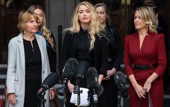 LONDON, ENGLAND - JULY 28: Amber Heard reads a statement after the trial at the Royal Courts of Justice, Strand on July 28, 2020 in London, England.  Hollywood Actor Johnny Depp is suing News Group Newspapers (NGN) and the Sun's executive editor, Dan Wootton, over an article published in 2018 that referred to him as a 