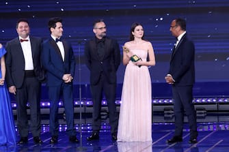 ROME, ITALY - MAY 03: (L-R) Michele Savoia, Luigi Calagna, Gianluca Leuzzi and Sofia Scalia are awarded with the David di Donatello of the Audience by Carlo Conti during the 67th David Di Donatello show on May 03, 2022 in Rome, Italy. (Photo by Vittorio Zunino Celotto/Getty Images)