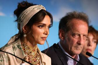 CANNES, FRANCE - MAY 17: Deepika Padukone, Vincent Lindon and Rebecca Hall attend the Jury press conference during the 75th annual Cannes film festival at Palais des Festivals on May 17, 2022 in Cannes, France. (Photo by Andreas Rentz/Getty Images)