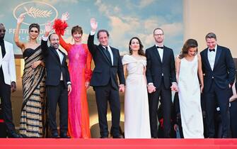 CANNES, FRANCE - MAY 17: (L-R) Ladj Ly, Deepika Padukone, Asghar Farhadi, Rebecca Hall, Vincent Lindon, Noomi Rapace, Joachim Trier, Jasmine Trinca and Jeff Nichols attend the screening of "Final Cut (Coupez!)" and opening ceremony red carpet for the 75th annual Cannes film festival at Palais des Festivals on May 17, 2022 in Cannes, France. (Photo by Stephane Cardinale - Corbis/Corbis via Getty Images)