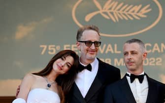 (FromL) US actress Anne Hathaway, US director James Gray and US actor Jeremy Strong arrive for the screening of the film "Armageddon Time" during the 75th edition of the Cannes Film Festival in Cannes, southern France, on May 19, 2022. (Photo by CHRISTOPHE SIMON / AFP) (Photo by CHRISTOPHE SIMON/AFP via Getty Images)