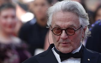 epa09961115 Director George Miller arrives for the screening of 'Three Thousand Years of Longing' during the 75th annual Cannes Film Festival, in Cannes, France, 20 May 2022. The movie is presented out of competition at the festival which runs from 17 to 28 May .  EPA / GUILLAUME HORCAJUELO