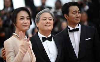 (From L) Chinese actress Tang Wei, South Korean producer Park Chan-Wook and South Korean actor Park Hae-Il arrive for the screening of the film "Decision to Leave (Heojil Kyolshim)" during the 75th edition of the Cannes Film Festival in Cannes, southern France, on May 23, 2022. (Photo by LOIC VENANCE / AFP) (Photo by LOIC VENANCE/AFP via Getty Images)