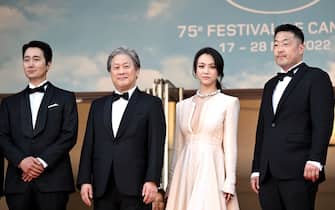 (From L) South Korean actor Park Hae-Il, South Korean director Park Chan-Wook, Chinese actress Tang Wei arrive for the screening of the film "Decision to Leave (Heojil Kyolshim)" during the 75th edition of the Cannes Film Festival in Cannes, southern France, on May 23, 2022. (Photo by LOIC VENANCE / AFP) (Photo by LOIC VENANCE/AFP via Getty Images)
