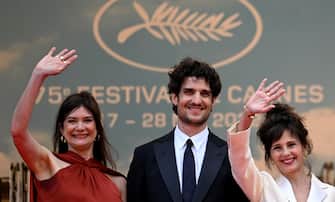 (From L) French producer Anne-Dominique Toussaint, French actor and director Louis Garrel and French actress Anouk Grinberg arrive for the screening of the film "The Innocent (L'Innocent)" during the 75th edition of the Cannes Film Festival in Cannes, southern France, on May 24, 2022. (Photo by PATRICIA DE MELO MOREIRA / AFP) (Photo by PATRICIA DE MELO MOREIRA/AFP via Getty Images)