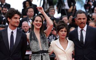 (From L) French actor and director Louis Garrel, French actress Noemie Merlant, French actress Anouk Grinberg and French-Moroccan actor Roschdy Zem arrive for the screening of the film "The Innocent (L'Innocent)" during the 75th edition of the Cannes Film Festival in Cannes, southern France, on May 24, 2022. (Photo by Valery HACHE / AFP) (Photo by VALERY HACHE/AFP via Getty Images)