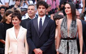 CANNES, FRANCE - MAY 24: Anouk Grinberg, Louis Garrel and Noémie Merlant attend the 75th Anniversary celebration screening of "The Innocent (L'Innocent)" during the 75th annual Cannes film festival at Palais des Festivals on May 24, 2022 in Cannes, France. (Photo by Daniele Venturelli/WireImage)
