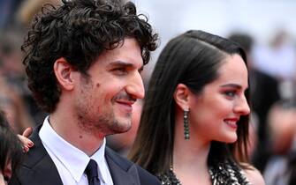 CANNES, FRANCE - MAY 24: Director Louis Garrel and Noémie Merlant attend the 75th Anniversary celebration screening of "The Innocent (L'Innocent)" during the 75th annual Cannes film festival at Palais des Festivals on May 24, 2022 in Cannes, France. (Photo by Gareth Cattermole/Getty Images)