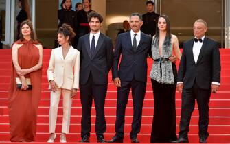 CANNES, FRANCE - MAY 24: (L-R) Producer Anne-Dominique Toussaint, Anouk Grinberg, Louis Garrel, Roschdy Zem, Noémie Merlant and a guest attend of the film "Les Amandiers" (Forever Young) attend the 75th Anniversary celebration screening of "The Innocent (L'Innocent)" during the 75th annual Cannes film festival at Palais des Festivals on May 24, 2022 in Cannes, France. (Photo by Dominique Charriau/WireImage)