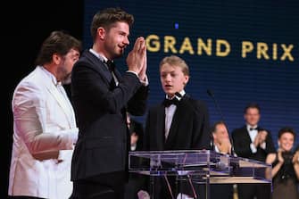 CANNES, FRANCE - MAY 28: Director Lukas Dhont and Eden Dambrine receive the Grand Prize Palm d'Or Award for the movie 'Close' during the closing ceremony for the 75th annual Cannes film festival at Palais des Festivals on May 28, 2022 in Cannes, France. (Photo by Pascal Le Segretain/Getty Images)