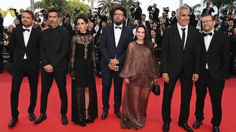 CANNES, FRANCE - MAY 28: The cast of "Holy Spider" (L-R) Sol Bondy, Mehdi Bajestani, Zar Amir Ebrahimi, Farouzan Jamshidneajad, guest, Arash Ashtiani and Jacob Jarek attend the closing ceremony red carpet for the 75th annual Cannes film festival at Palais des Festivals on May 28, 2022 in Cannes, France. (Photo by Pascal Le Segretain/Getty Images)