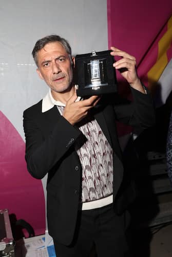 ROME, ITALY - JUNE 20: Filippo Timi poses with his Best Comedy Actor Award for "Il Filo Invisibile" at the 76th Nastri D'Argento 2022 on June 20, 2022 in Rome, Italy. (Photo by Daniele Venturelli/Daniele Venturelli / WireImage  )