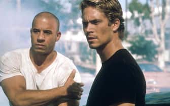 388654 01:  Actors (left to right) Vin Diesel (Pitch Black) and Paul Walker (Varsity Blues) star in Universal Studios action-adventure film "The Fast And The Furious." (Photo by Bob Marshak/2001 Universal Studios)