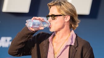 19 July 2022, Berlin: Brad Pitt, actor, drinks water as he arrives at the German premiere of the motion picture '' Bullet Train '' at the Zoopalast.  (Credit Image: Â © Christoph Soeder / dpa via ZUMA Press)