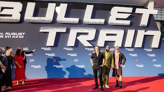 19 July 2022, Berlin: Aaron Taylor-Johnson (lr), Brian Tyree Henry, and Brad Pitt, all actors, arrive at the German premiere of the feature film '' Bullet Train '' at the Zoopalast.  (Credit Image: Â © Christoph Soeder / dpa via ZUMA Press)