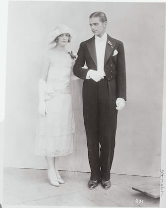 (Original Caption) Another Fairbanks in the Films. Los Angeles, California: Above is pictured Doug Fairbanks, Jr., son of the famous screen star, wlith his cousin, Miss Flobelle Fairbanks, who appears with Doug Jr. in his forthcoming feature, Stella Dallas. The appearance of Miss Fairbanks in the movies makes the third member of the illustrious family to attann screen fame. Incidently, it may be noticed that Doug Jr., with the aid of makeup, appears very much like his father, to judge from the light moustache he wears. August 4, 1925.