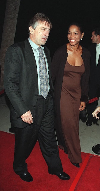 (Original Caption) Robert DeNiro, the movie's co-star, arrives with his girlfriend Grace Hightower. (Photo by Frank Trapper/Corbis via Getty Images)