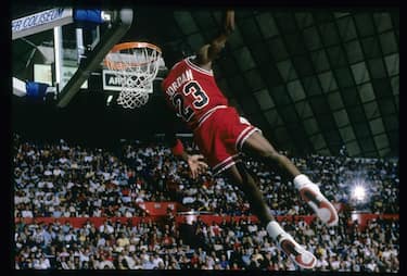 CIRCA 1987:  Michael Jordan #23 of the Chicago Bulls goes for the slam dunk during a circa 1987 NBA basketball game. Jordan played for the Bulss from 1984-93 and 1995 - 98. (Photo by Focus on Sport/Getty Images)