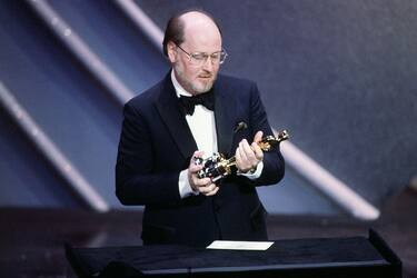 (Original Caption) Composer John Williams gives his acceptance speech while looking at his Oscar for the Best Original Score for E.T. during the 1982 Academy Awards Ceremony.