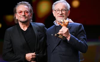 21 February 2023, Berlin: Irish musician Bono (l) awards US director Steven Spielberg with the Berlinale's Honorary Golden Bear. The 73rd International Film Festival will take place in Berlin from Feb. 16-26, 2023. Photo: Jens Kalaene/dpa