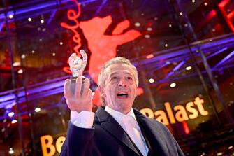 25 February 2023, Berlin: Joao Canijo, director and screenwriter, is happy to receive the Silver Bear Jury Prize for the film "Mal Viver" ("Bad Living") after the Berlinale awards ceremony. The 73rd International Film Festival will be held in Berlin from 16 - 26.02.2023. Photo: Fabian Sommer/dpa (Photo by Fabian Sommer/picture alliance via Getty Images)